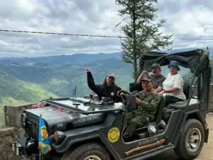 tourists in a jeep with loop trails tour ha giang