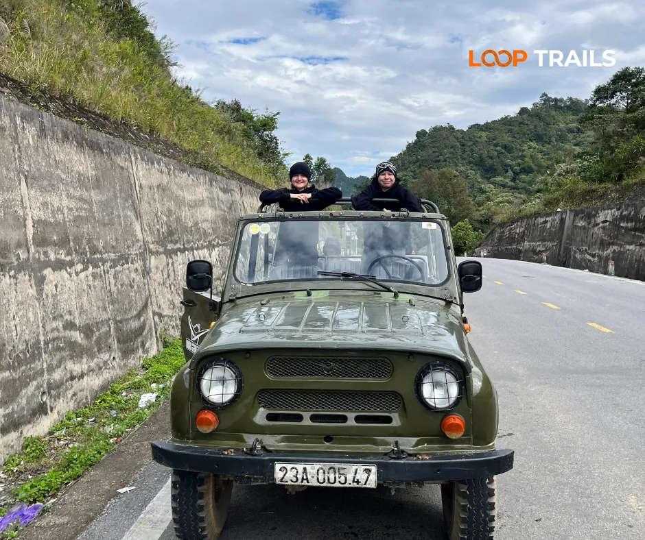 Ha Giang Cao Bang 5 days 4 nights - Standing on a Jeep at a mountain pass in Ha Quang