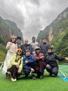 tourist on a boat of nho que river with ha giang loop trails