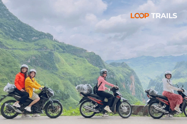 Motorbike rider on Ma Pi Leng Pass above Nho Que River, Ha Giang Loop Vietnam