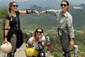 tourist take photos in quan ba twins mountain