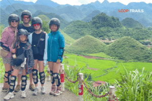 a family doing the ha giang loop with looptrails in quan ba twin mountains