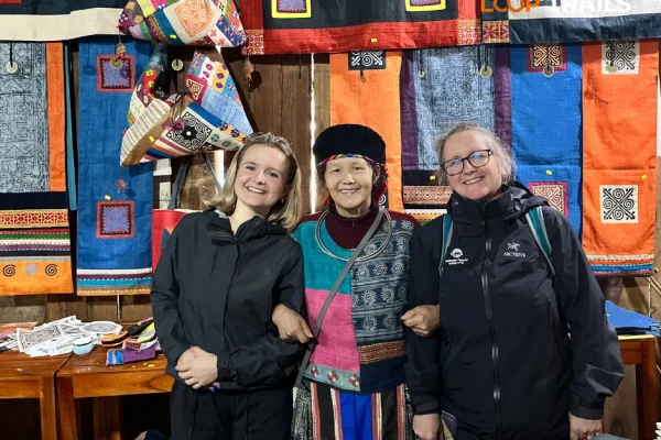 Hmong woman weaving hemp fabric on traditional back-strap loom in Lung Tam village, Ha Giang