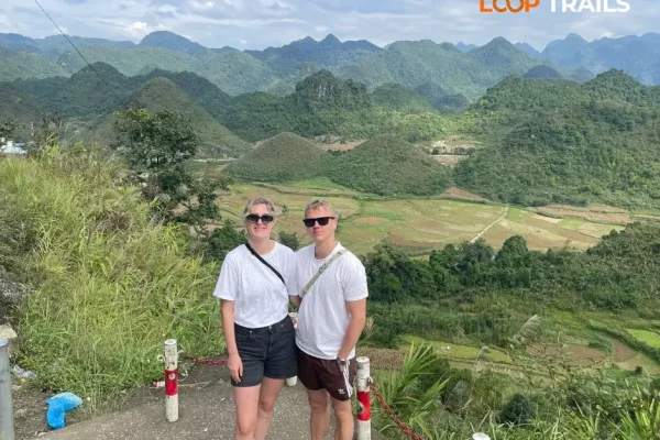 Tourists at Quan Ba Heaven Gate viewing platform overlooking Twin Mountains valley