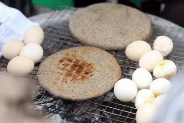 Buckwheat cake banh tam giac mach grilled at Dong Van market Ha Giang
