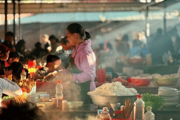Meo Vac Sunday market food stalls ethnic minority vendors Ha Giang food guide