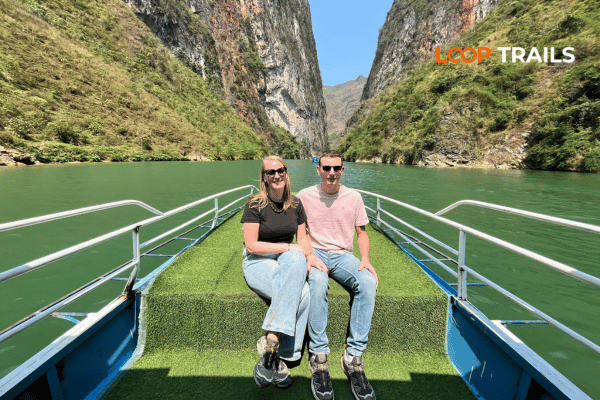 a coupes on a boat in nho que river tour