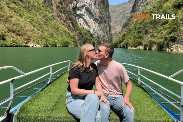 a couple on a boat in nho que river