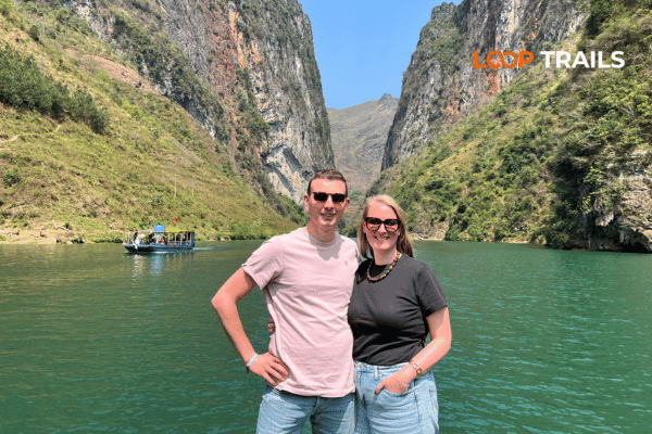 a couple on a boat in nho que river