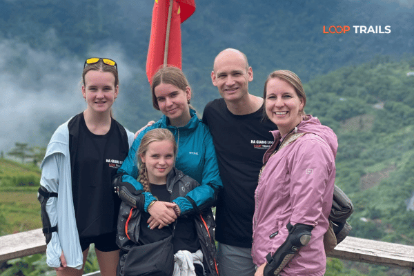 a family doing the ha giang loop with looptrails in bac sum pass Vietnam vs Thailand for Adventure Travel