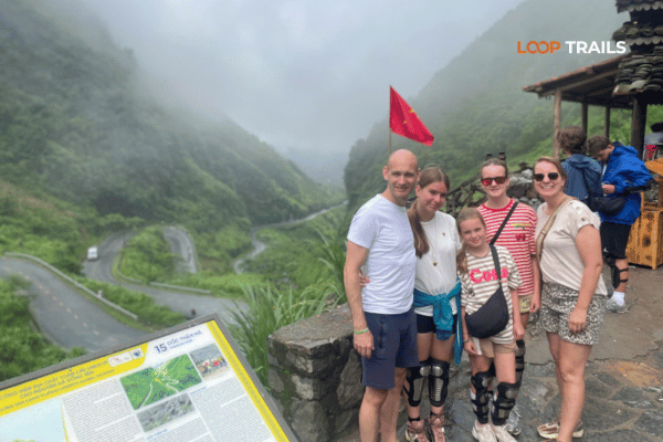 a family doing the ha giang loop with looptrails tham ma pass