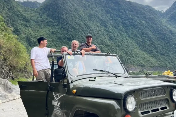 Family jeep tour on Ha Giang Loop through mountain roads