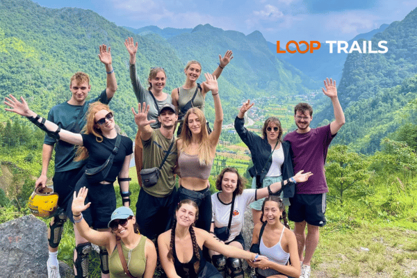 Successful Ha Giang Loop tour group at northern Vietnam viewpoint