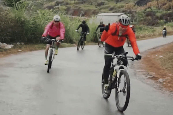 Mountain bike on Ha Giang Loop road near the Dong Van plateau ha giang loop cycling guide