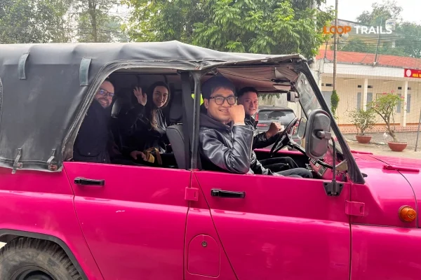 4WD jeep tour vehicle at scenic viewpoint on Ha Giang Loop Vietnam 2026
