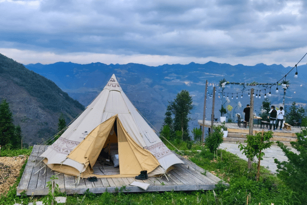Tents pitched on a terrace overlooking the Dong Van karst plateau
