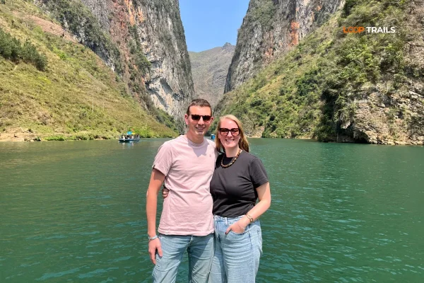 a couple on a boat in nho que river tour
