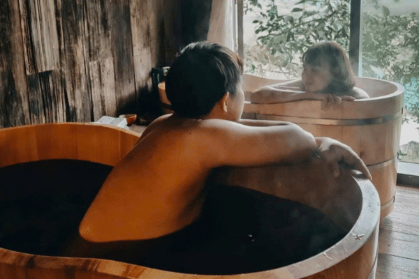 Traditional Red Dao herbal bath barrel inside a homestay in Ha Giang