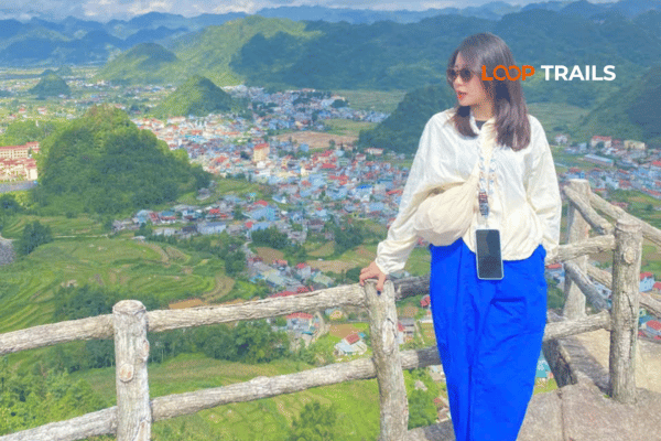 Tourists at Quan Ba Heaven Gate viewing platform overlooking Twin Mountains valley