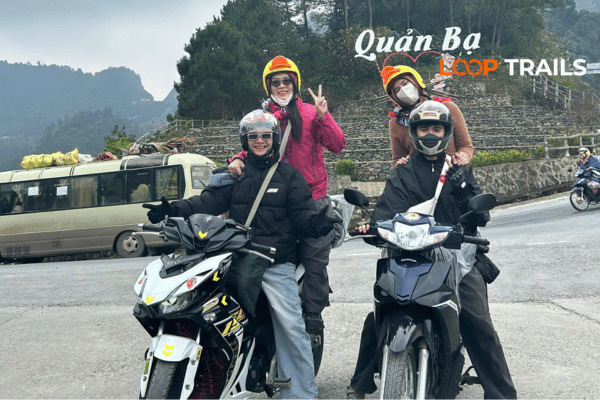 Easy rider guide and traveler on guided motorbike tour through Ha Giang mountains