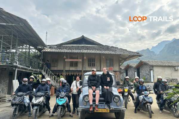 a group start a jouney by jeep and motorbike with ha giang loop trails