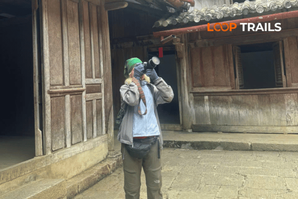 Photographer shooting in the vuong king's palace Ha giang loop camera gear guide