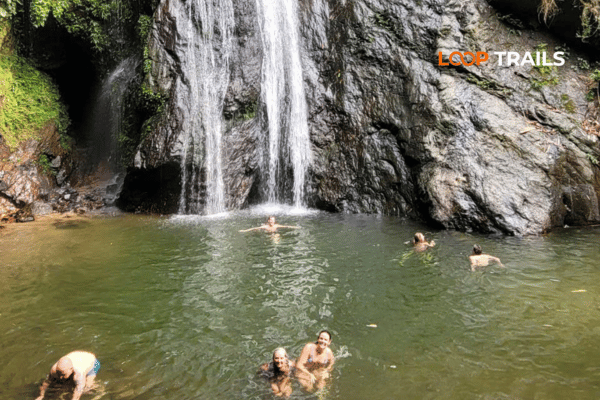 tourist of looptrails swimming in du gia waterfall