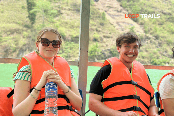 tourist of looptrails wearing life vest on a boat trip
