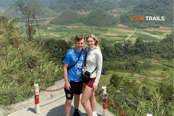 tourist standing at quan ba twins mountains