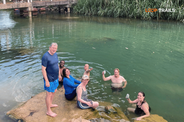 tourists of looptrails are swimming in a lake
