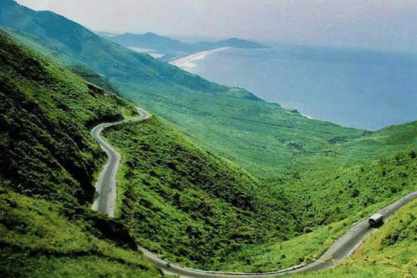 Motorbike riders on the Hai Van Pass coastal road between Hue and Da Nang