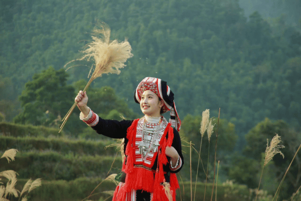 Red Dao woman in traditional red headdress in Hoang Su Phi, Ha Giang