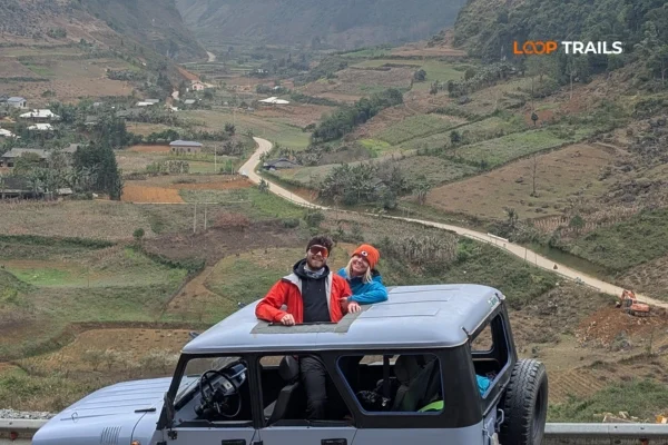 4WD jeep tour vehicle at scenic viewpoint on Ha Giang Loop Vietnam 2026