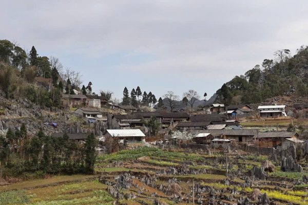 H'mong farmer in traditional house in buckwheat fields Sung La Valley